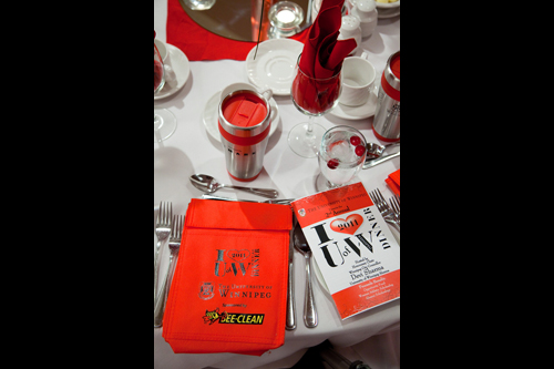 Closeup of table setting with program
