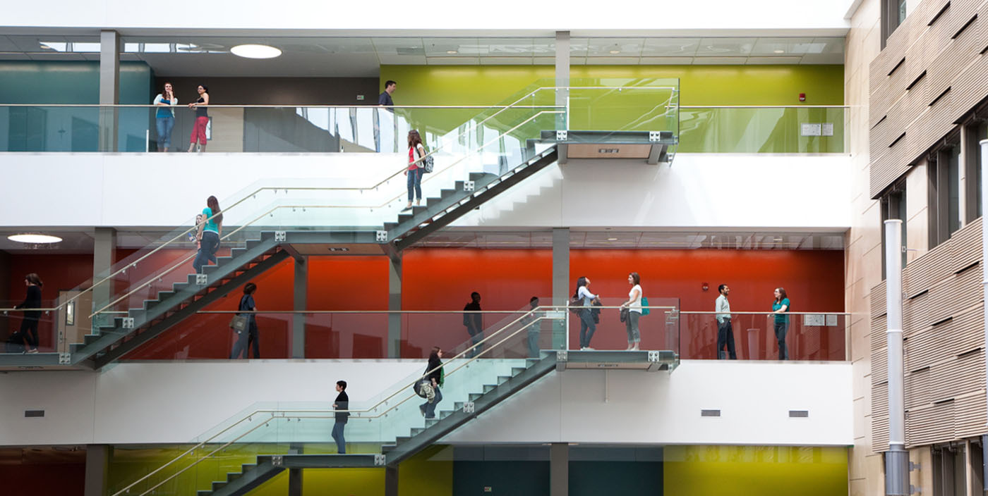Photo of three students walking on stairs in Richardson College by Atrium