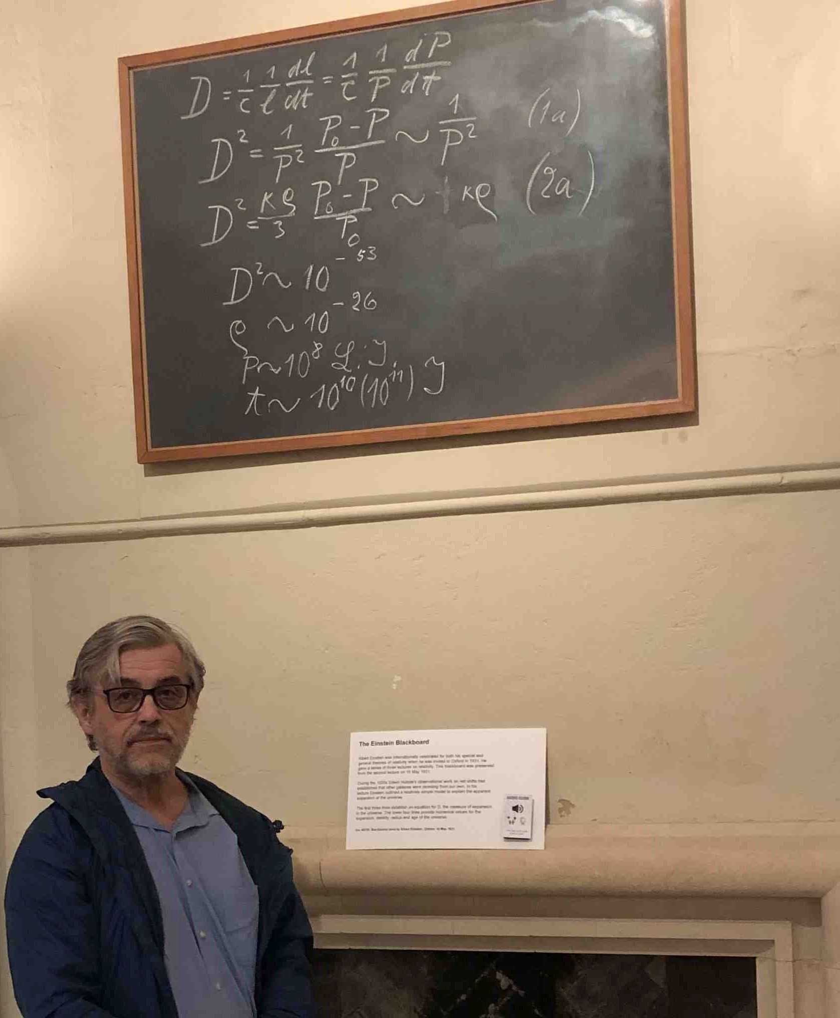 dwight at oxford in front of Einstein's chalkboard