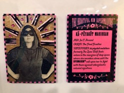 2 sides of a trading card, one side with a masked woman, the other side with text