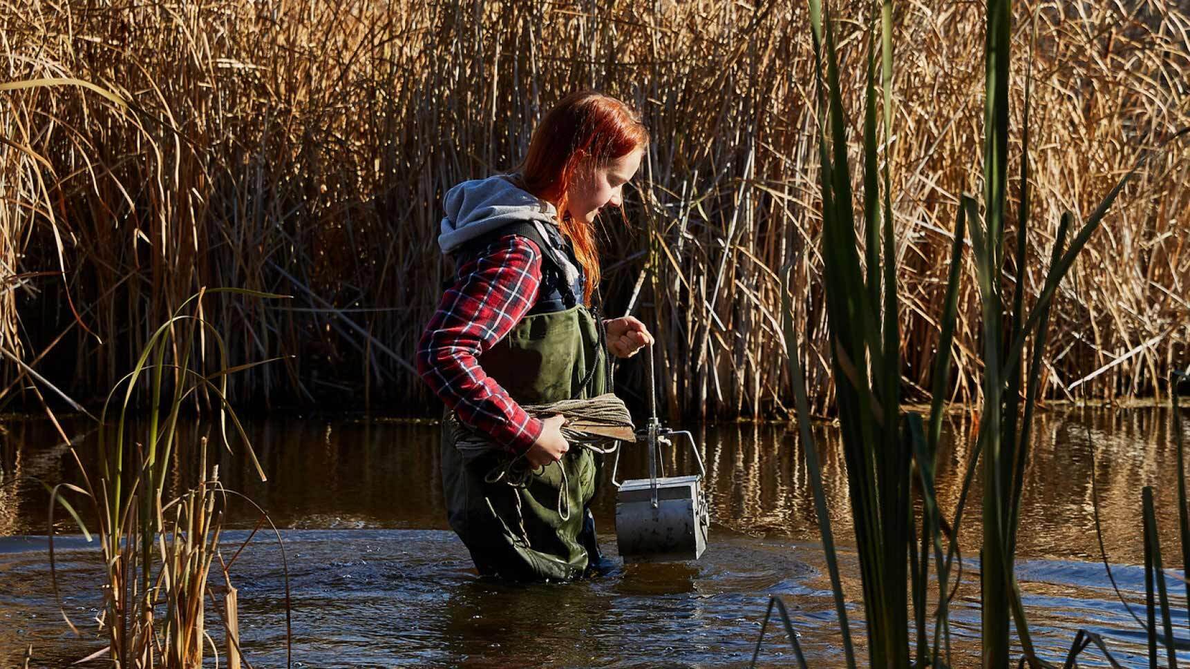 Student in marsh