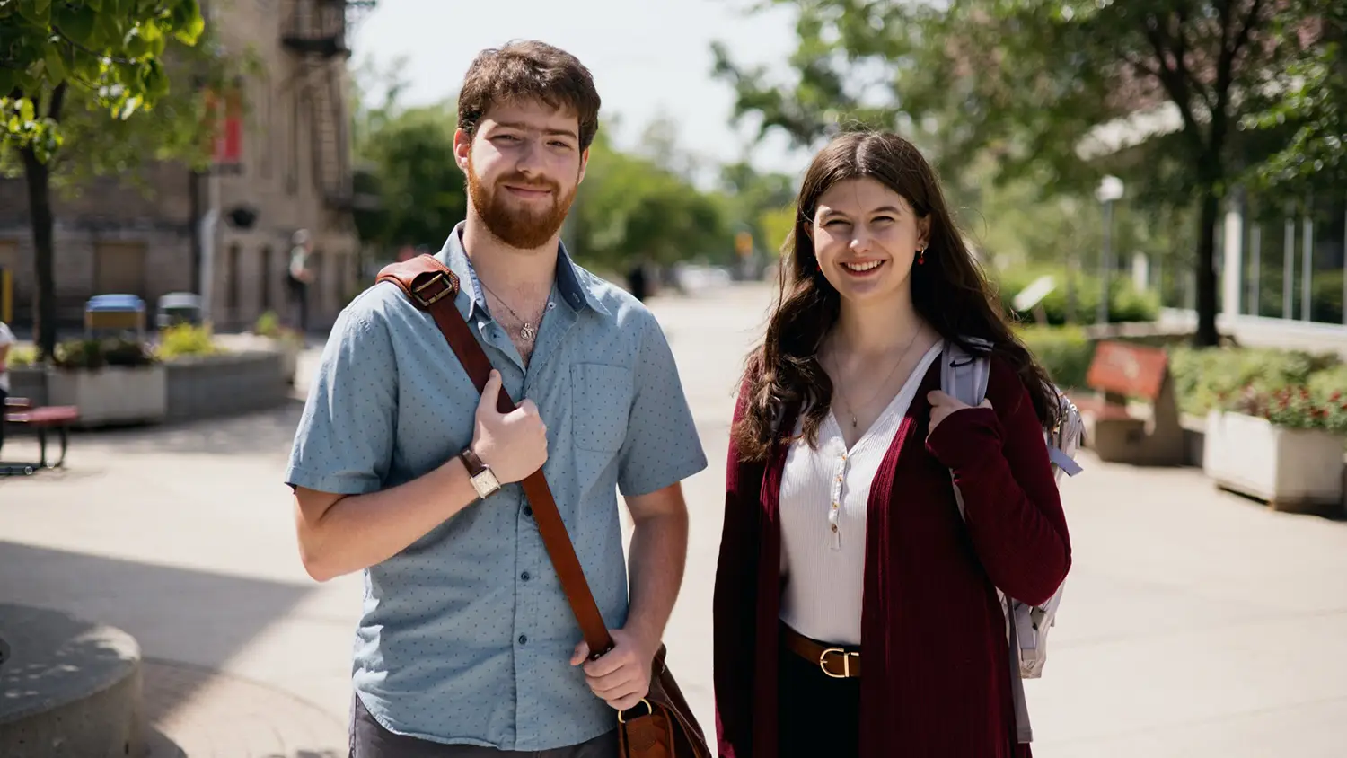 Two Students outside smiling at camera