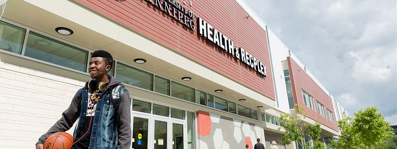 Student walks outside of Axworthy Health & RecPlex