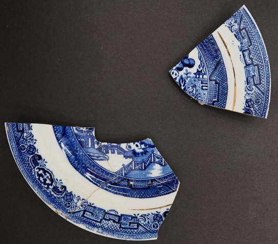 sherds of blue willow plate