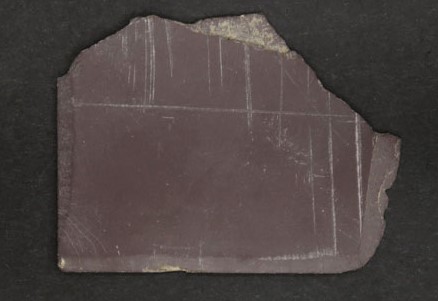 Fragment of writing slate with incised lines