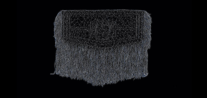 Video still of a digital model of a woven Tlingit Raven’s Tail  robe. Thin white intersecting/web-like lines form the outlines of the blanket design and fringes on a black background.