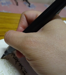 hand doing calligraphy