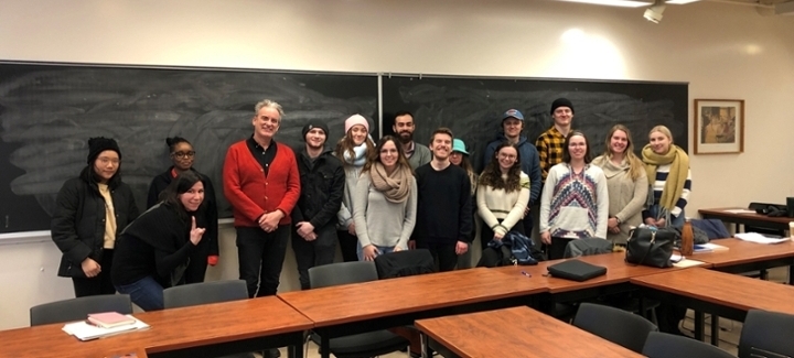 Dr. Clint Burnham is pictured with students with students in classroom