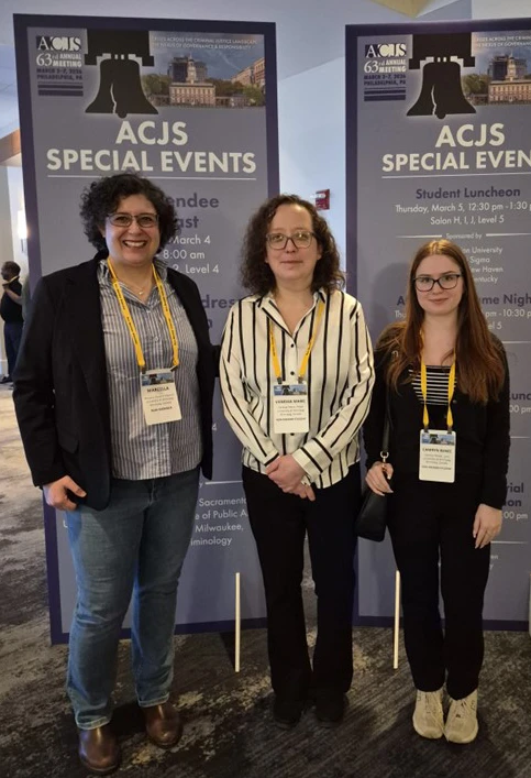Dr. Marcella Cassiano with two students