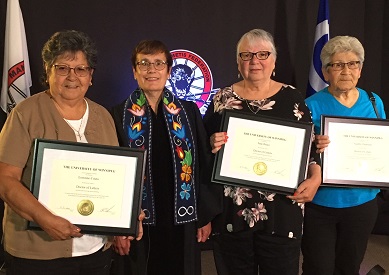 three elders standing with Dr. Annette Trimbee receiving HD award
