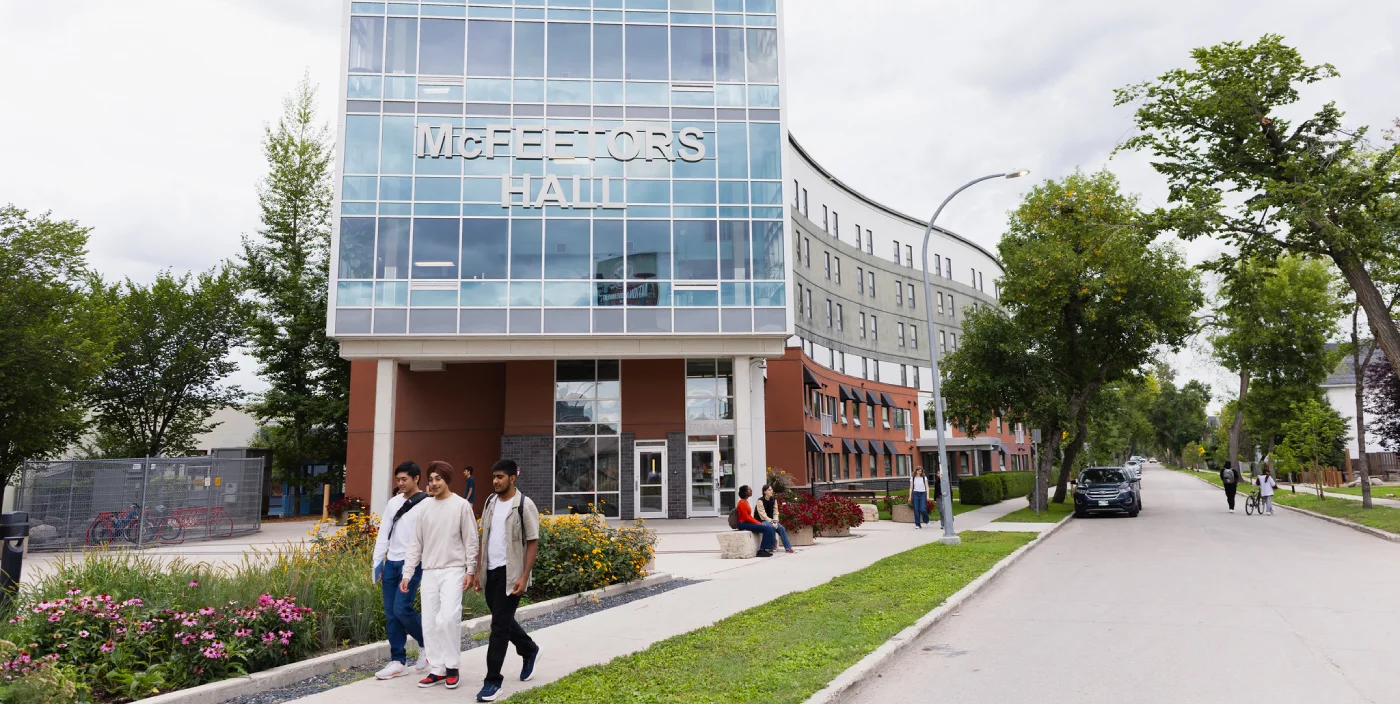 Students walk in front of McFeetor's Hall at UWinnipeg
