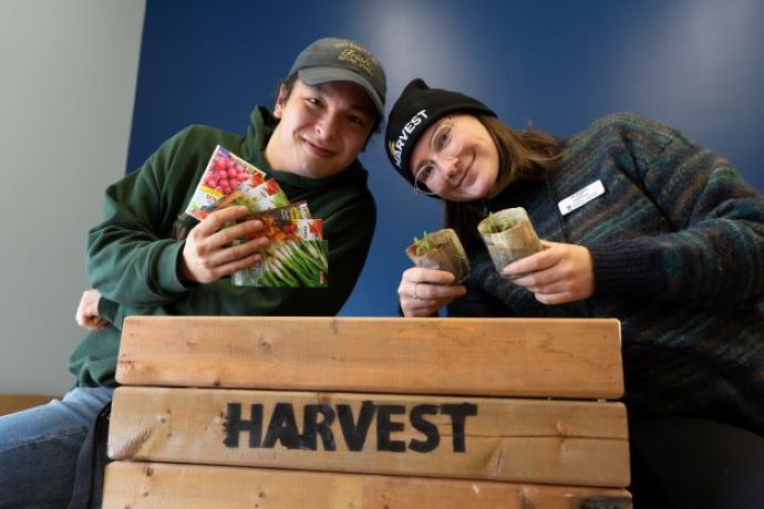 Two students volunteering at Harvest