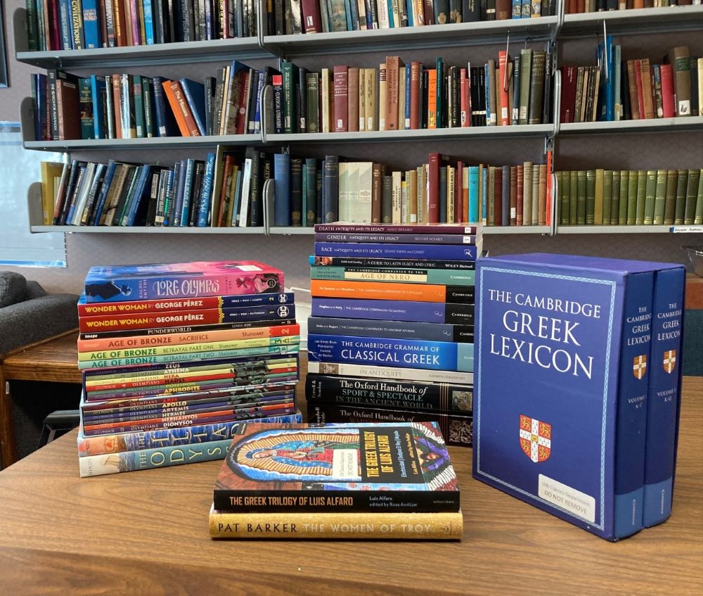 New books for Classics Library on a table in common room; list of titles available on webpage