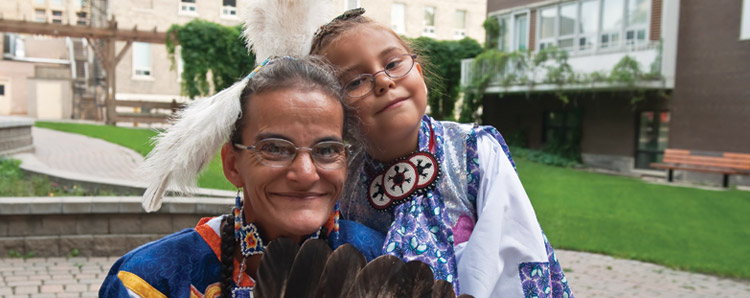 Community Home, woman and child in pow wow regalia