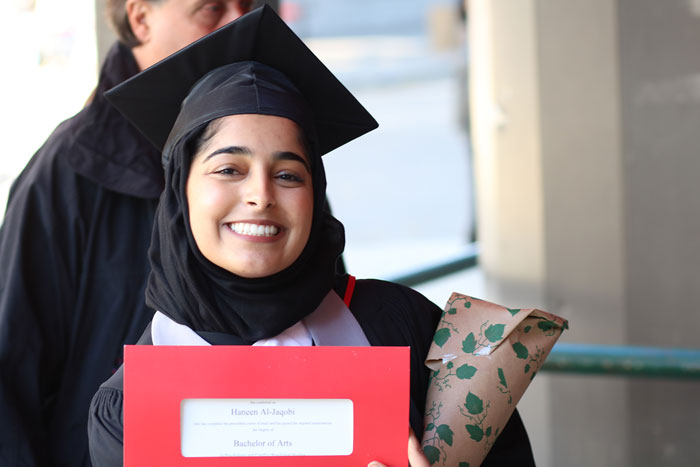 Smiling graduate after the convocation ceremony