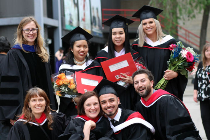 Group photo of Arts students and faculty from Spring 2018 convocation