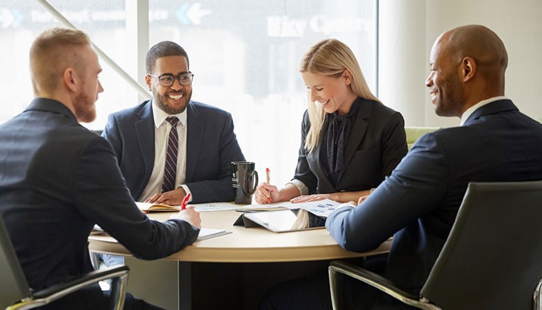 Four people at a round table