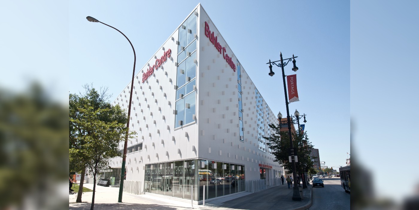 An angled view of a white building with red lettering that reads Buhler Centre