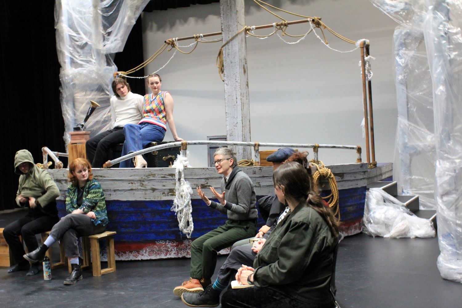 Cast and crew talking to audience members during debrief after performance of Forward