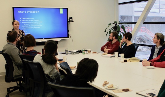 Image of Lauren Bosc giving a presentation to a group of people at the University of Winnipeg.