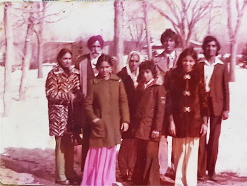 Eight people in winter landscape