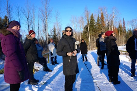 CSRG members stand on Shoal Lake 40's temporary bridge (photo credit: Karen Sharma)