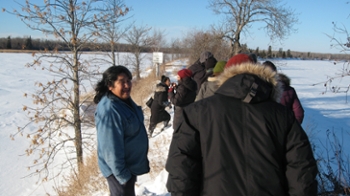 CSRG members walk along dike