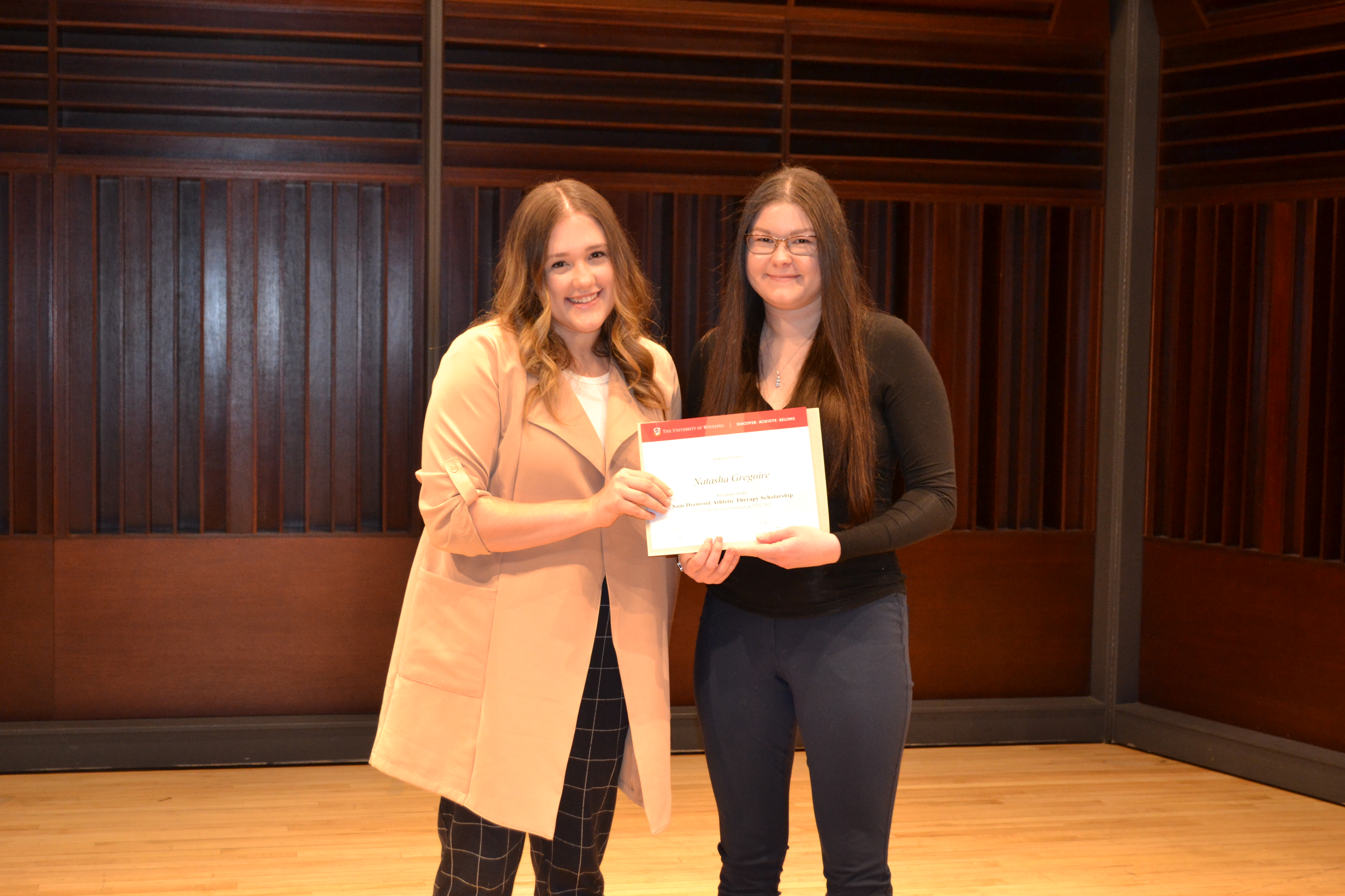 Jessica Diamond presenting an award to Natasha Gregoire