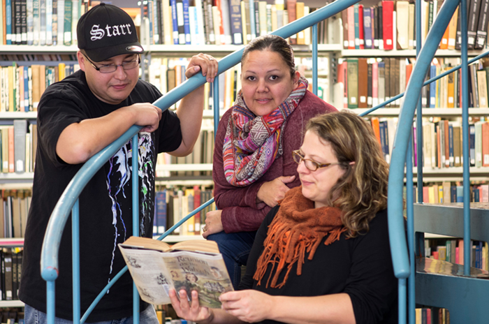 A group os UWinnipeg students in the library. 