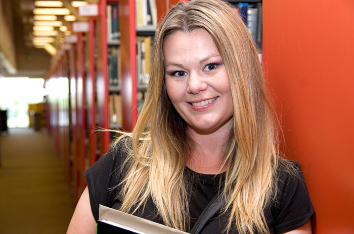 A Uwinnipeg student in the library. 