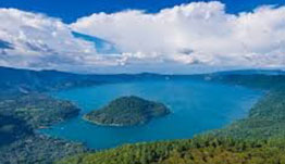 Lake Coatepeque, a large crater lake surrounded by wooded hills in western El Salvador