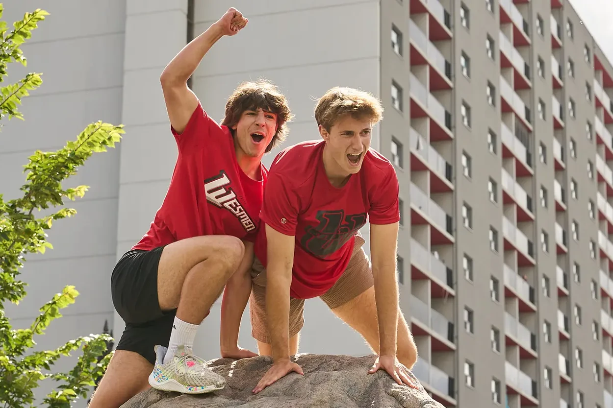 Two students cheer