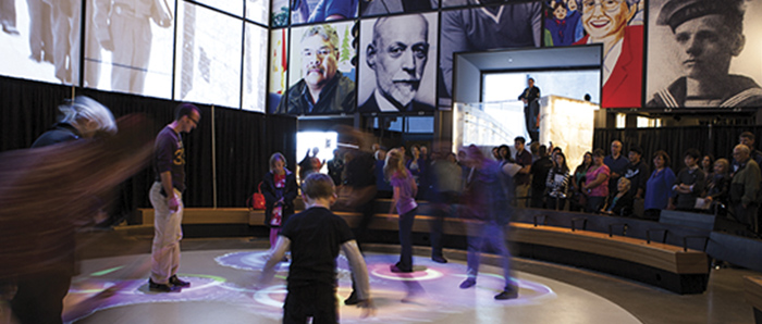 People interact with gallery at the Canadian Museum for Human Rights