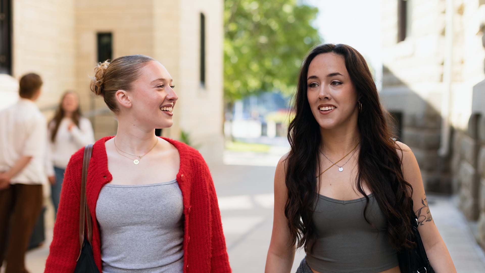 UWinnipeg Student on Wesley Hall front lawn