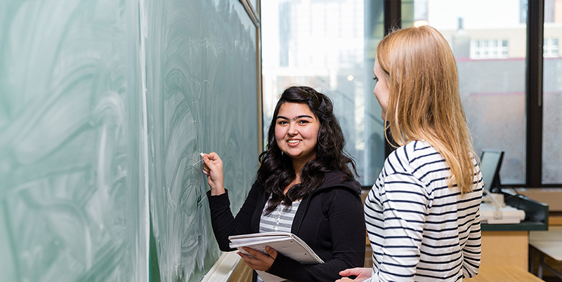 Students at chalkboard