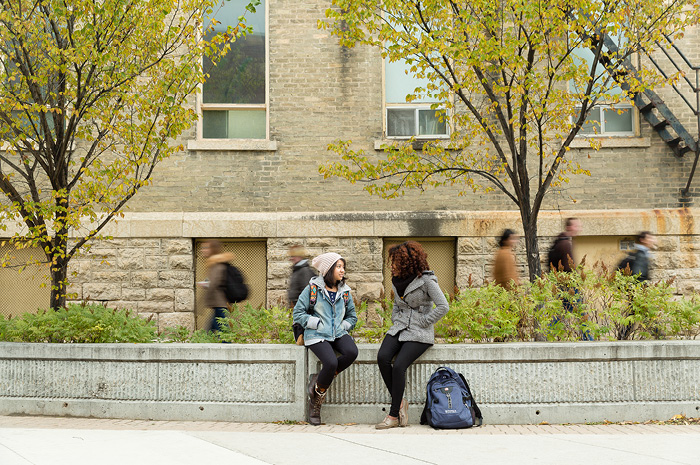 Students hanging out in front of the iconic Wesley Hall.