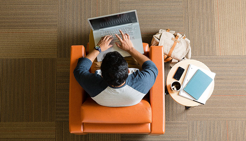 Student on laptop, photo taken from above