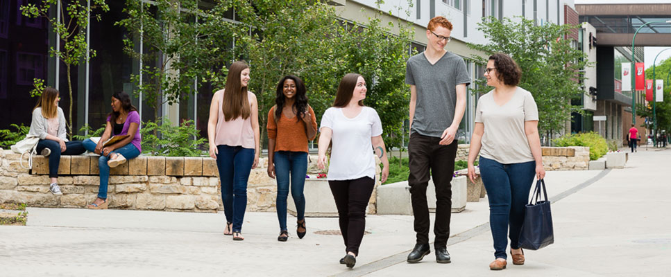 Students walk down Spence Street Corridor