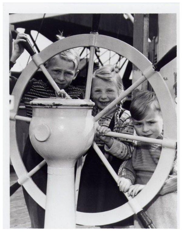 Three children on a boat