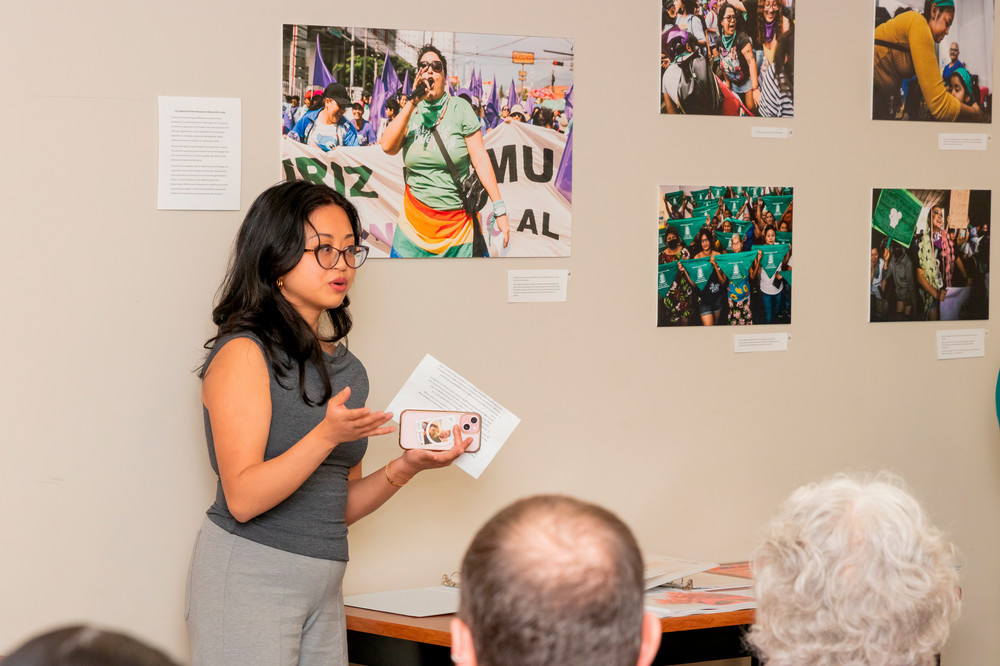 Andrea Ayo presents opening remarks at the event