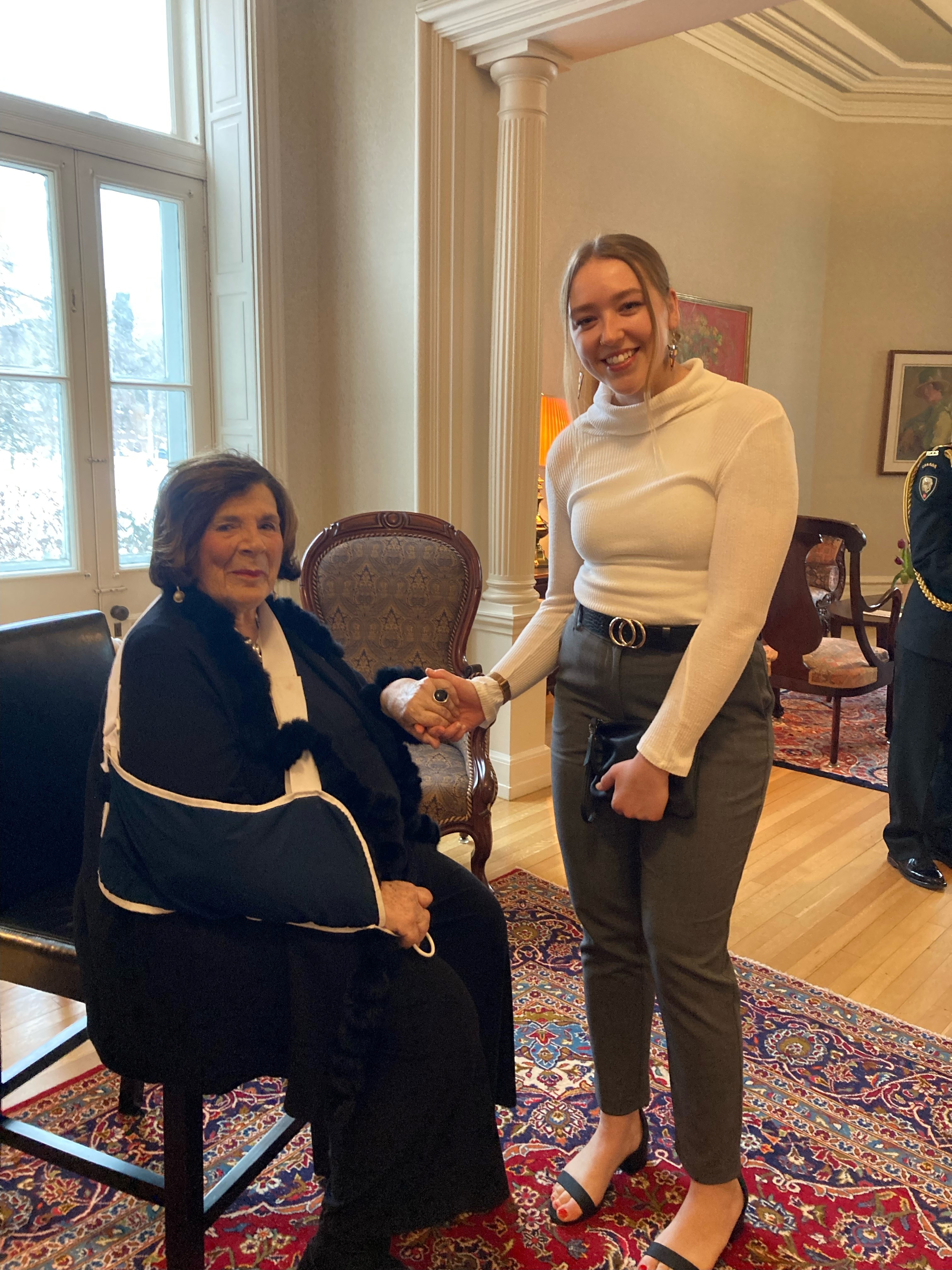 Anita Neville shakes hands with Meagan Dutka