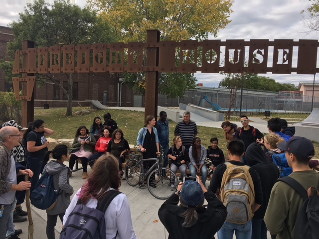 Michael Redhead Champagne leads youth from Hugh John McDonald School and RB Russell Vocational High School on a place-based “Village Walk” through Winnipeg’s Inner City
