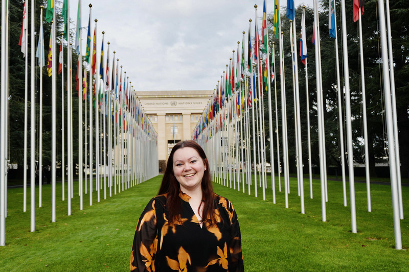 Katrina Leclerc stands in front of the Palais des Nations in Geneva