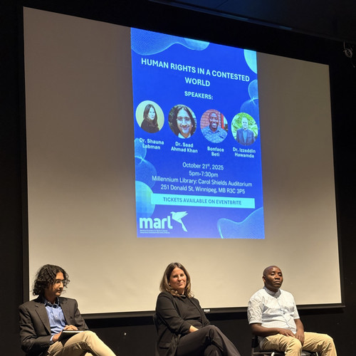 Dr. Saad Khan, Dr. Shauna Labman and Bonface Beti sitting on a stage