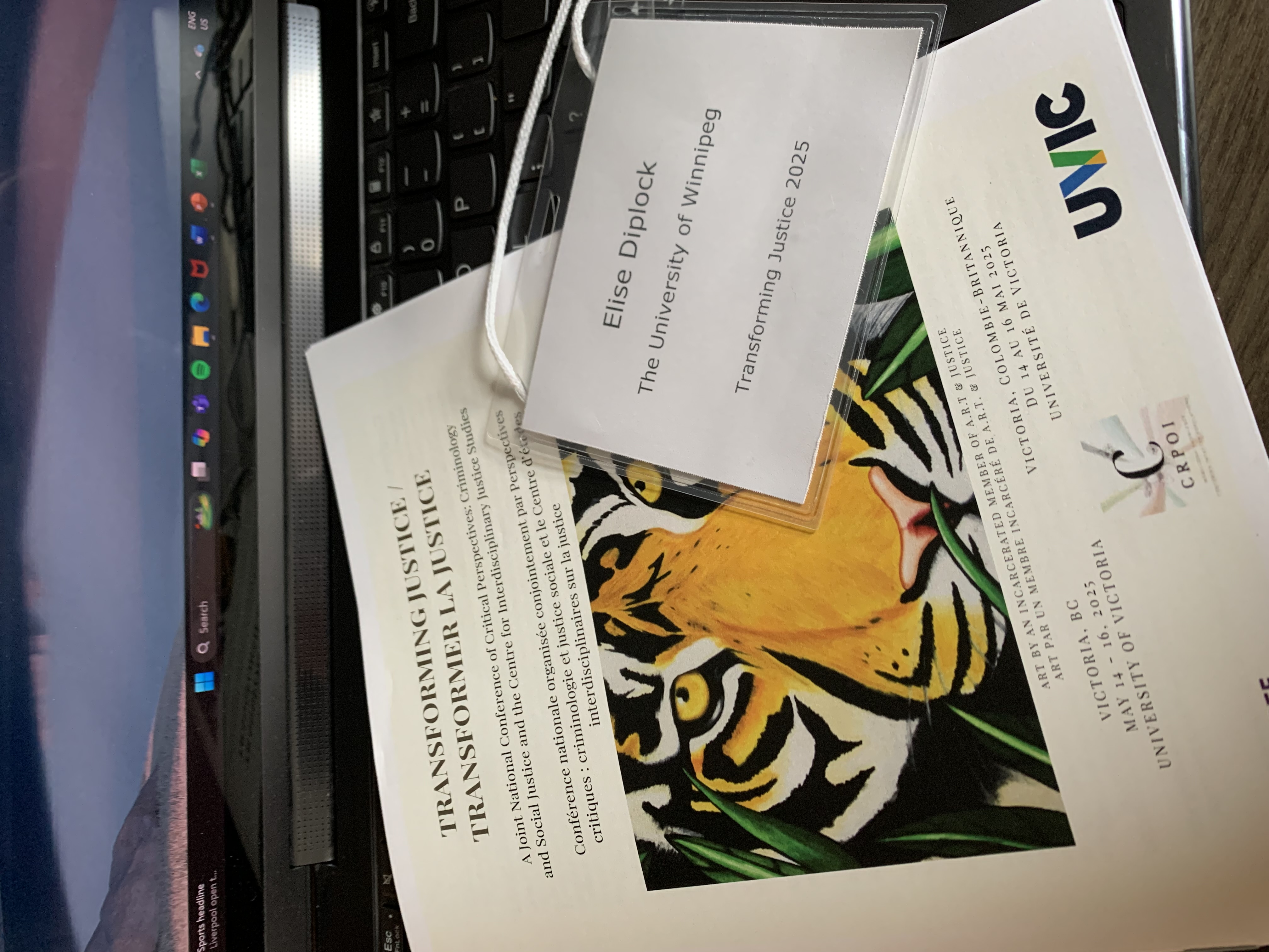 A nametag and conference brochure
