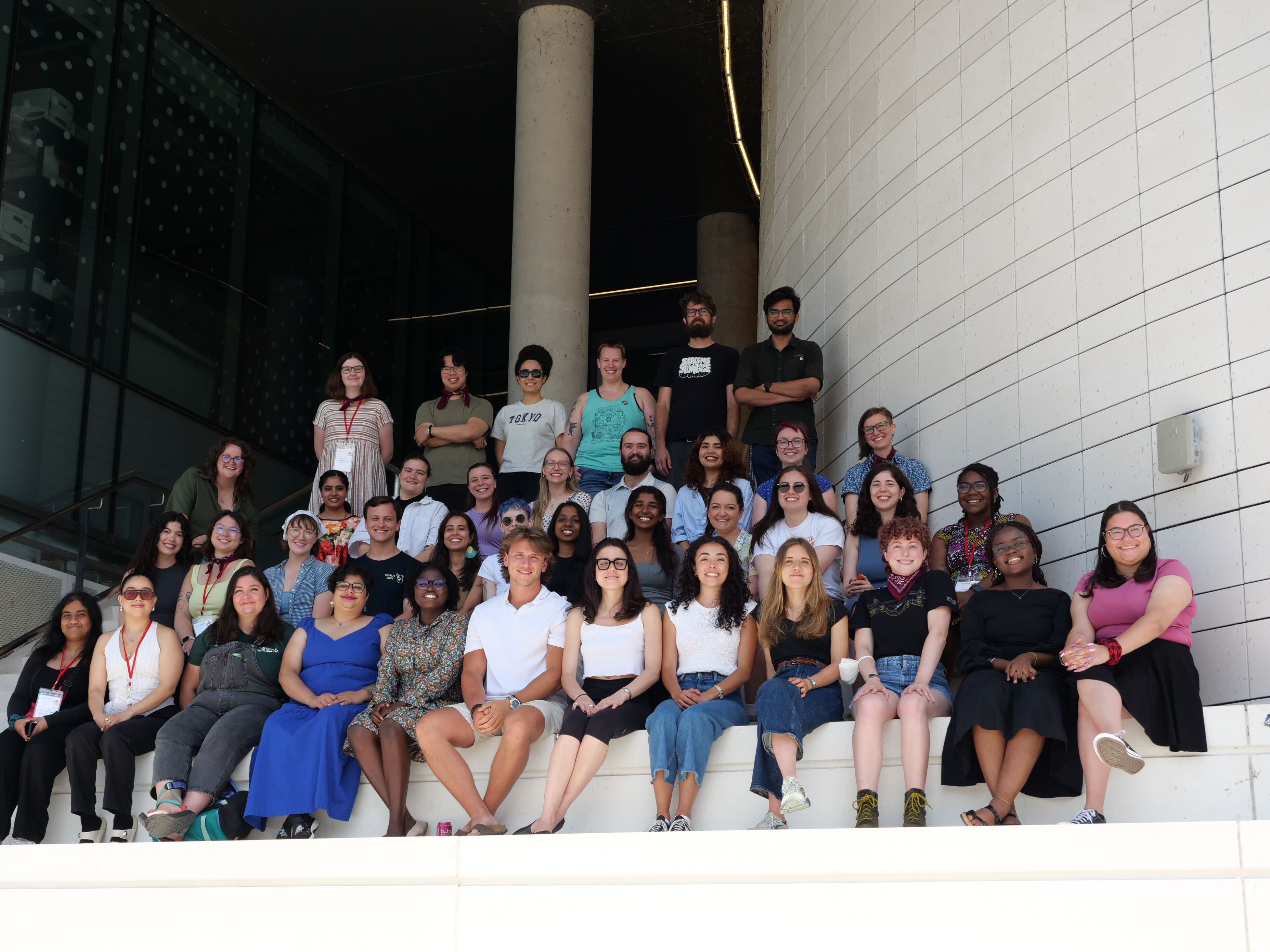ComSciCon Can participants sitting on a large staircase