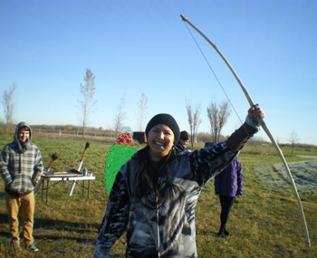 Student in the field with bow