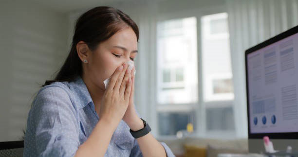 Person blowing nose