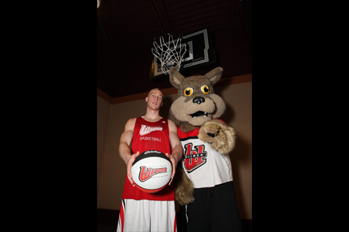 Weslee Coyote mascot with Wesmen player