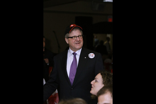 Lloyd Axworthy wearing a baseball cap